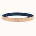 Navy belt with beige buckle on a white background