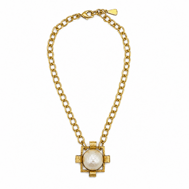 Gold necklace with a central pearl pendant on a white background