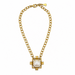 Gold necklace with a central pearl pendant on a white background
