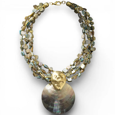 Necklace with shell pendant and gold accents on a white background