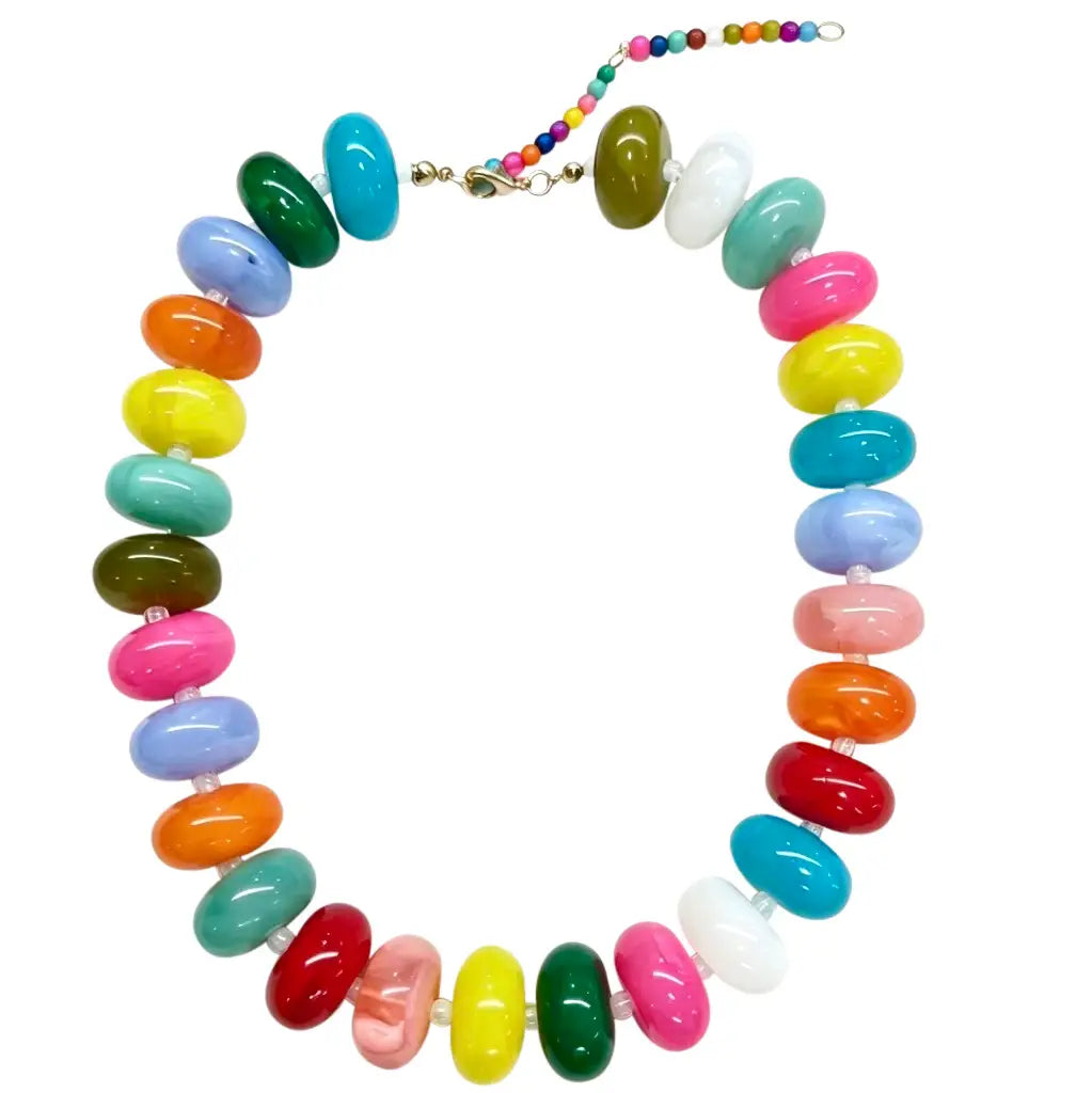 bright multi colored chunky beaded necklace with gold clasp on white background