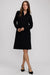 Woman wearing a black dress on a white background