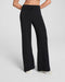 Black wide-leg pants worn by a person on a light gray background