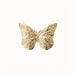Gold butterfly-shaped decorative piece on a white background