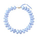 light blue chunky beaded necklace with gold clasp on white background