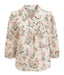 Floral blouse with ruffled collar on a white background