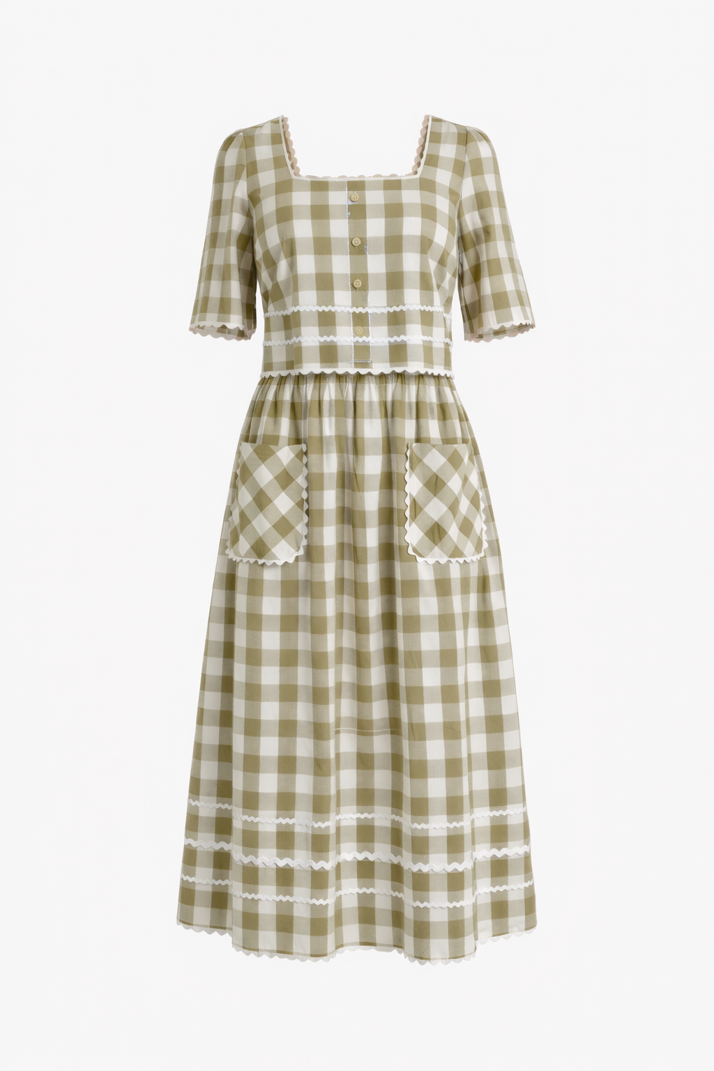 Green and white checkered dress with lace details on a white background