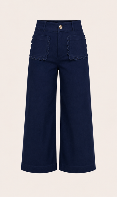 NAVY BLUE DENIM PANTS WITH BROWN BUTTON AND SCALLOP DETAIL FRONT POCKETS ON WHITE BACKGROUND