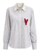 Striped shirt with a red lobster patch on a white background