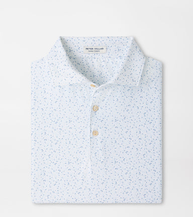 A folded Peter Millar men's long-sleeve polo shirt in a light blue and white micro-pattern, featuring a classic collar and two light tan buttons.