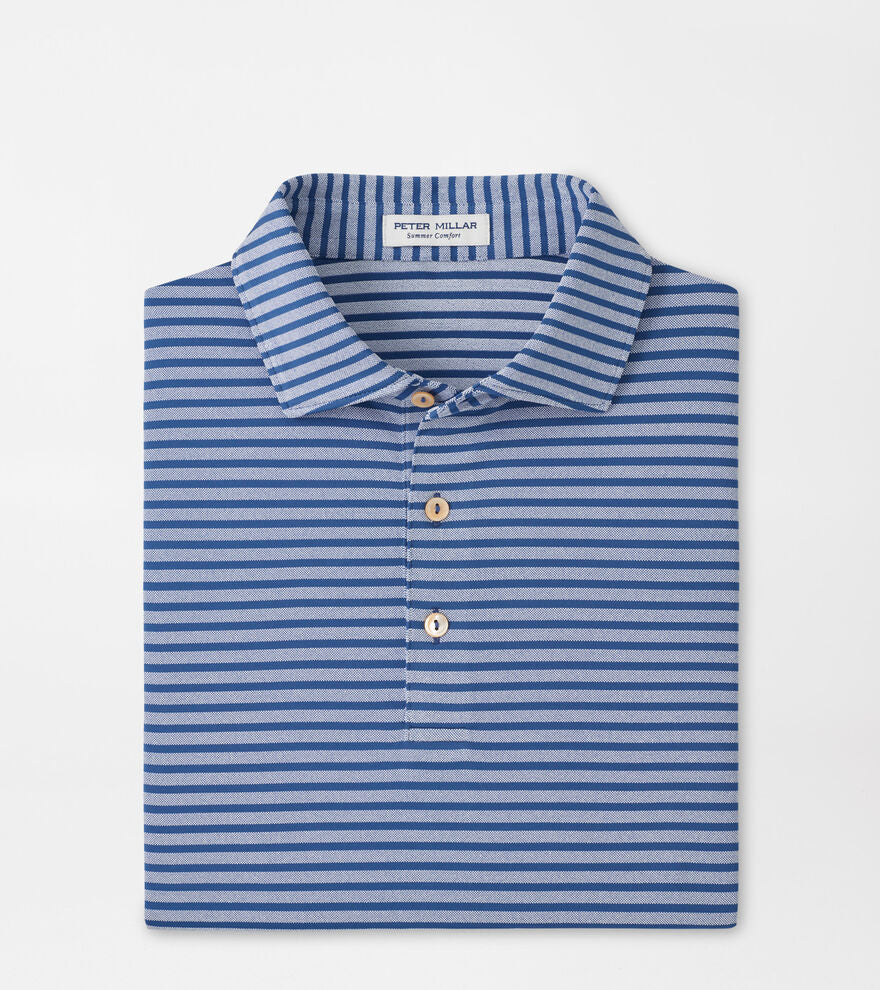 Folded blue and white striped polo shirt with 'Peter Millar' label on a light gray background