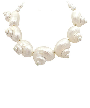 Necklace with shell-like beads on a white background