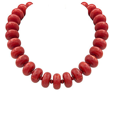 Red beaded necklace on a white background