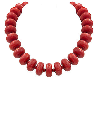 Red beaded necklace on a white background