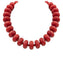Red beaded necklace on a white background