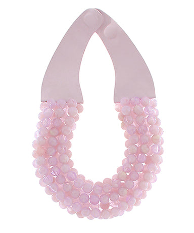 Necklace with pink beaded strands on a white background