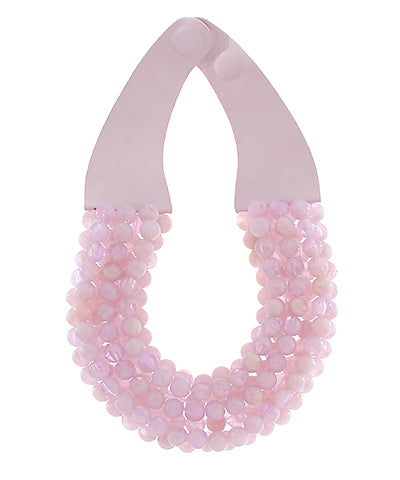Necklace with pink beaded strands on a white background