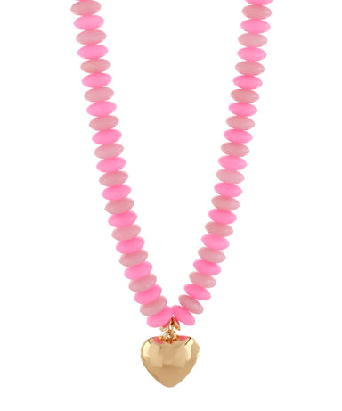 Necklace with pink beads and a gold heart pendant on a white background