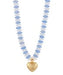 Necklace with blue beads and a gold heart pendant on a white background