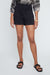 Person wearing black shorts on a white background