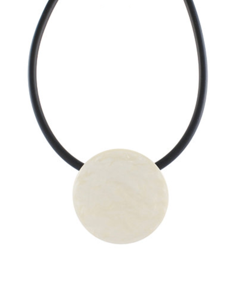 Necklace with a large white stone pendant on a white background