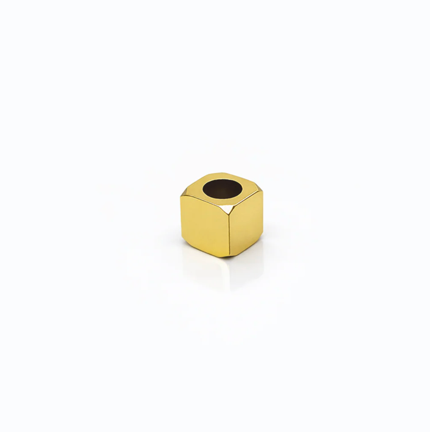 SQUARE OBJECT ON WHITE BACKGROUND WITH HOLE IN CENTER
