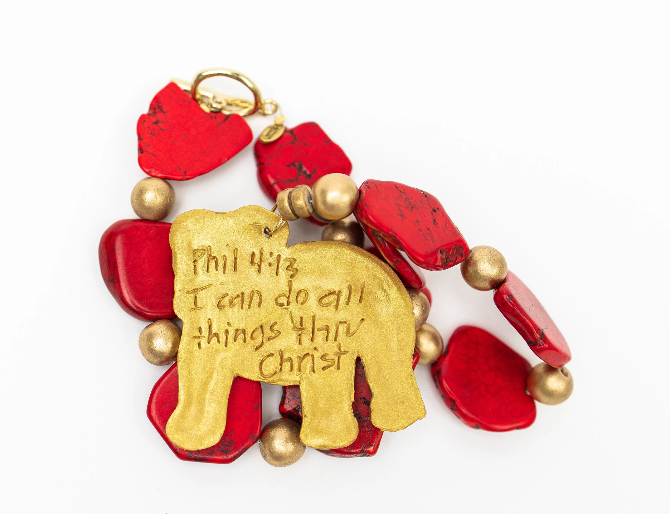RED MARBLE AND GOLD BEDADED NECKLACE WITH LARGE BULLDOG IN GOLD CLAY WITH PHIL 4:13 ENGRAVED ON BACK ON WHITE BACKGROUND