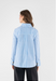 MODEL WEARING FRENCH BLUE STRIPE COLLAR BUTTON DOWN ON WHITE BACKGROUND TURNED TO BACK