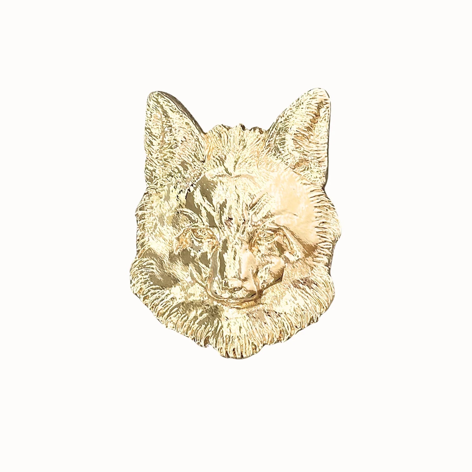 Gold wolf head wall decor on a white background