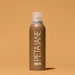 Peta Jane tanning mist spray bottle on a beige background