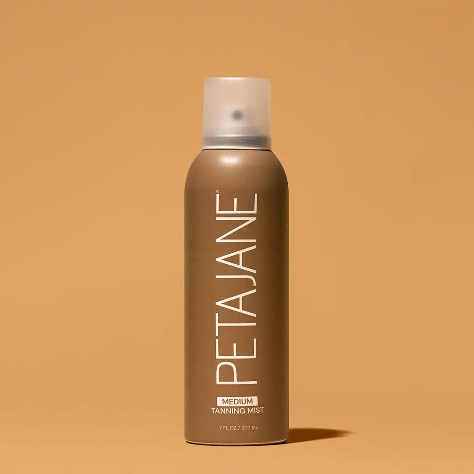 Peta Jane tanning mist spray bottle on a beige background
