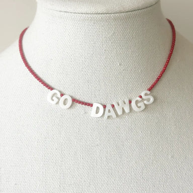 Necklace with 'GO DAWGS' on a mannequin bust
