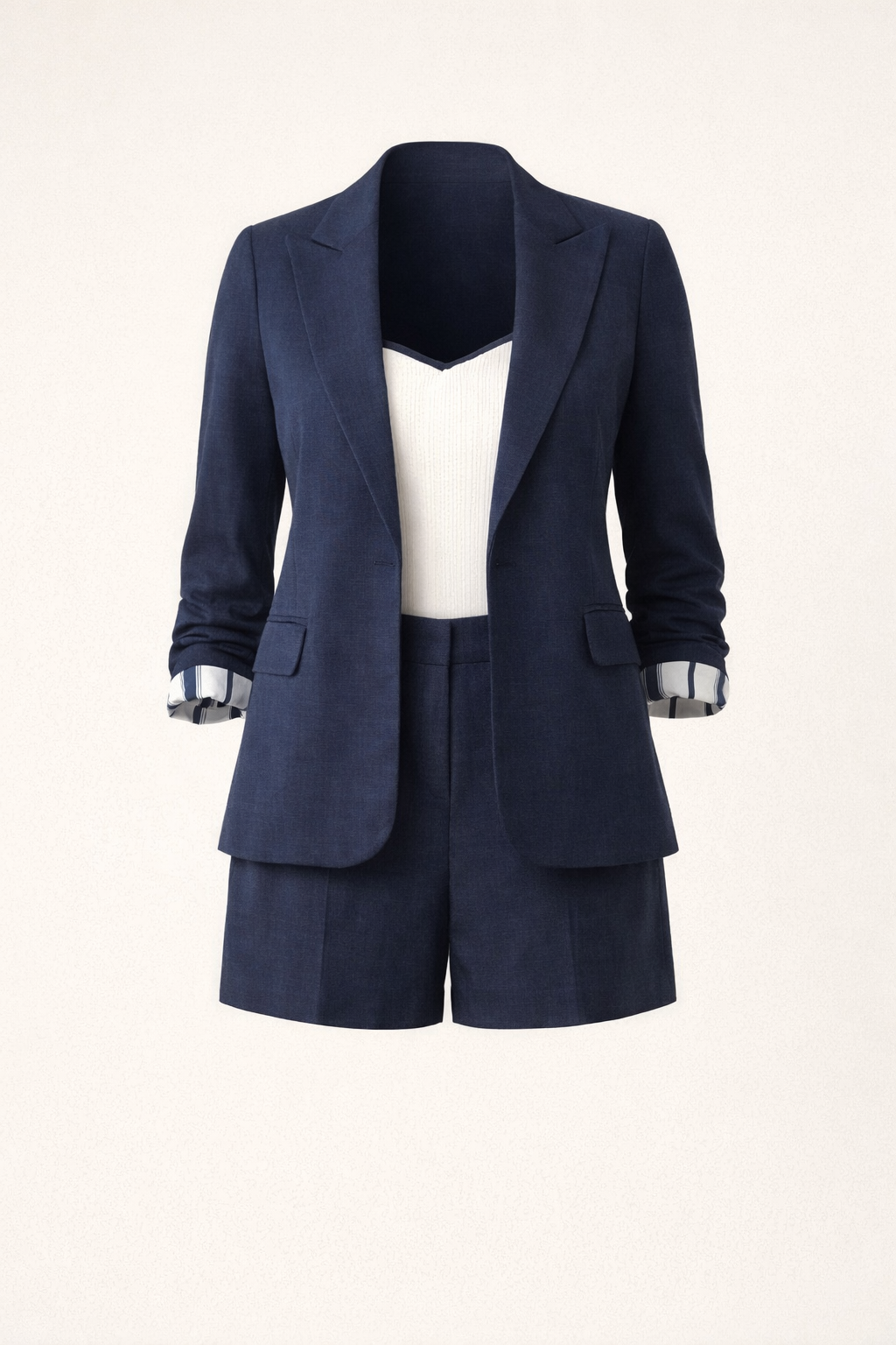 Navy blue blazer and shorts set on a white background