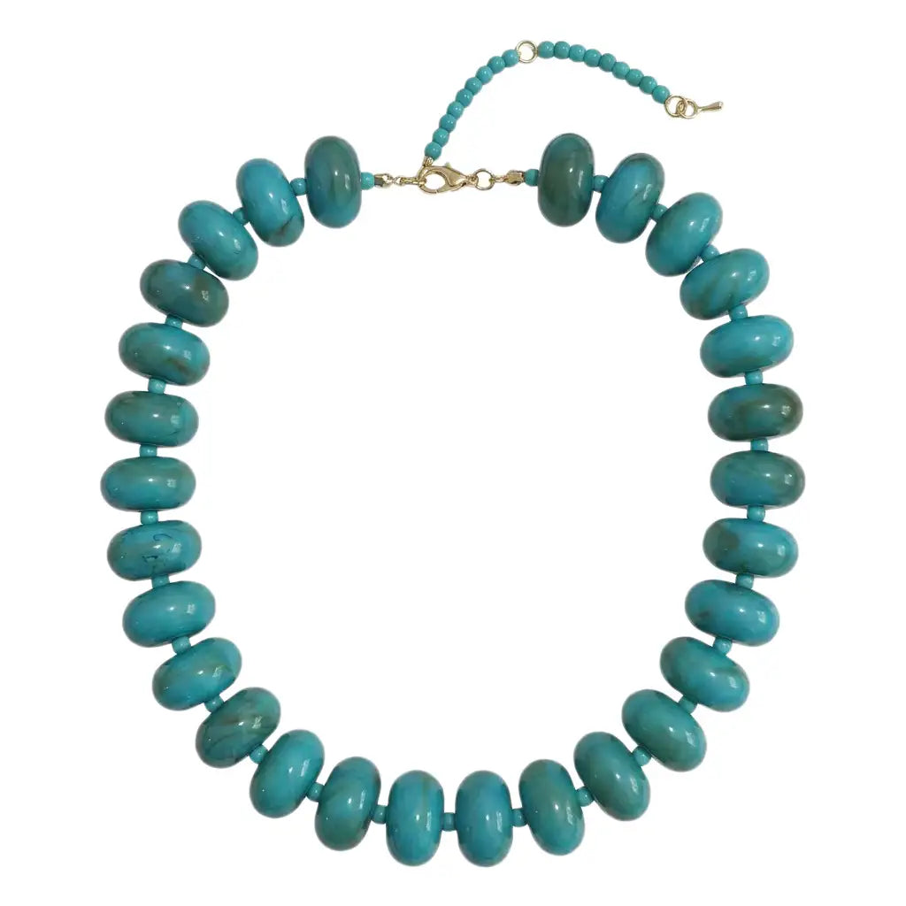 dark turquoise chunky beaded necklace with gold clasp on white background