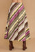 A midi skirt with diagonal stripes in olive green, magenta, brown, yellow, and cream, shown on a model from the back against a solid beige background.