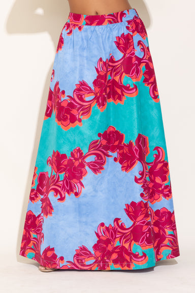 Colorful floral skirt with pink and blue pattern on a white background