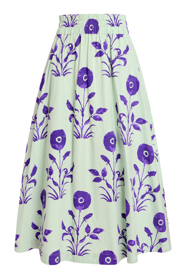 A high-waisted, A-line midi skirt featuring a purple floral and leaf pattern on a pale mint green background, shown against a plain white studio background.